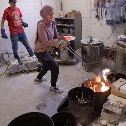 Len and student with raku kiln